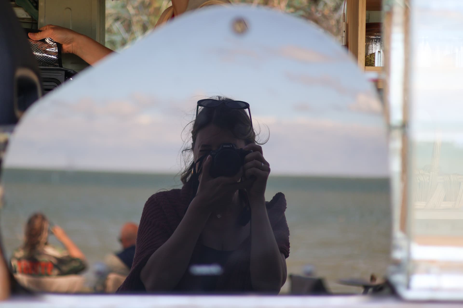 Self-portrait of Micky Humphrey photographing in a mirror